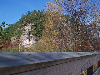 Bridge , rock face and fall color along the trail